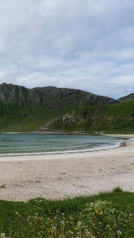 Vik Strand, Northern Norway — White sandy beach in Lofoten with clear blue waters, located north of the Arctic Circle.